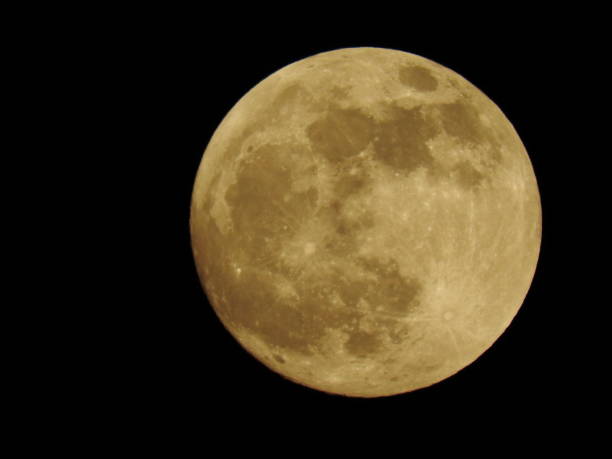 istock Close up beautiful full moon, view at craters. Black background. Special lunar, one day before full wolf red moon. 1124523068