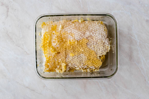 istock Fresh Honeycomb Pieces with Honey in Glass Bowl. 1124523683