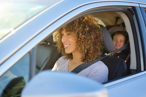 Woman in Car with Little Boy
