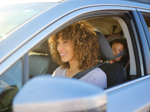 istock Woman in Car with Little Boy 1124524378