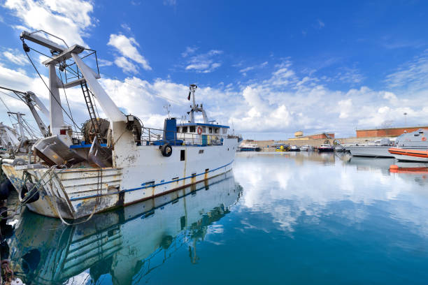 istock fishing boat sky cloud sea 1124525103