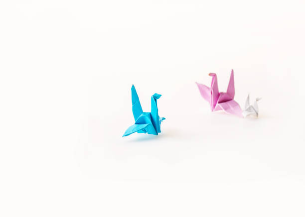 Origami bronze blue birds couple on a tree branch