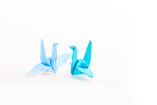 istock Origami birds paper on white background 1124525117