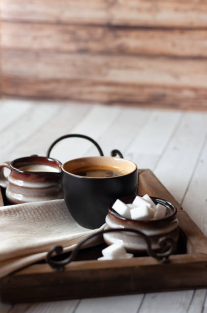 istock Mug of Coffee with Cream and Sugar Cubes 1124525845