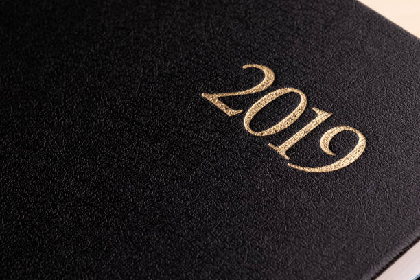 istock Closed black notepad with the inscription 2019 1124527052