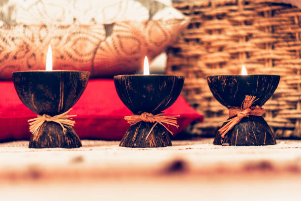 istock Burning spa aroma candles in coconut shell, cozy home interior 1124527468