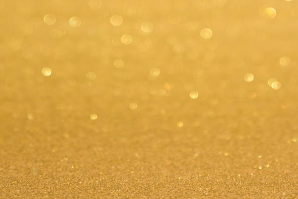 istock Golden defocused flickering lights for text and background 1124528530
