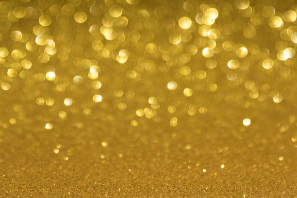 istock Golden defocused flickering lights for text and background 1124528875