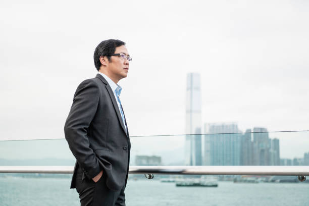 istock Businessman looking at city skyline 1124528899