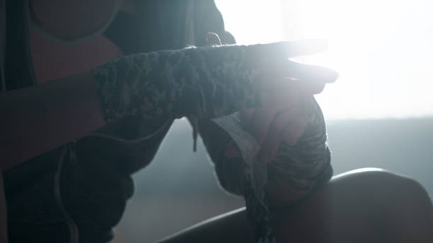 istock Female boxer wrapping hand with tape 1124530499