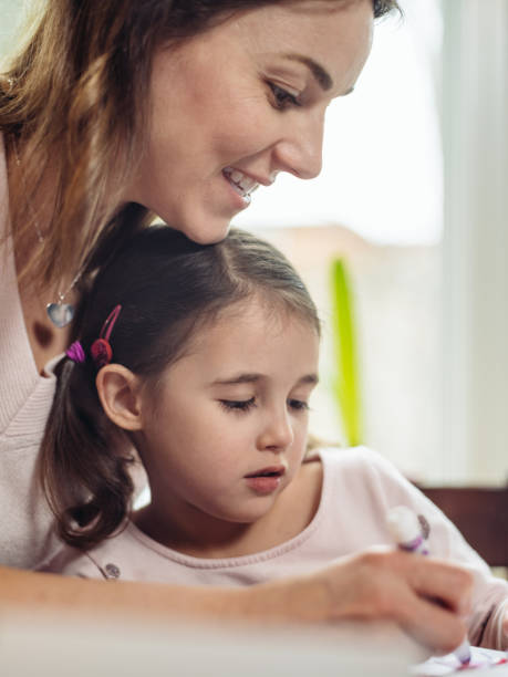 istock Mother and young daughter crafting for Valentine's Day 1124534862