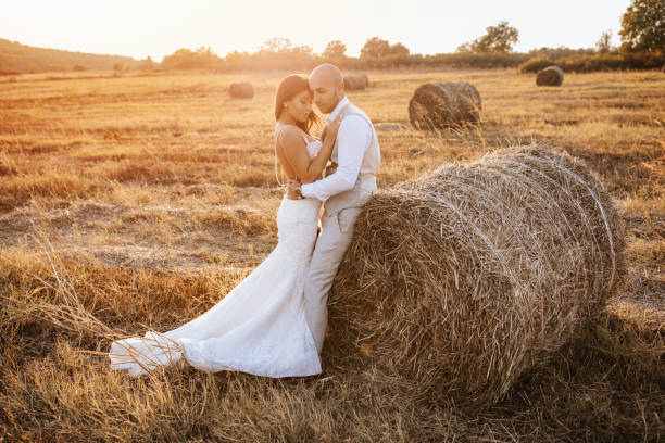 istock Wedding couple in a hay field 1124536449