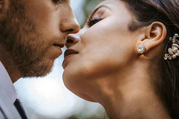istock Happy newlyweds kissing 1124536532