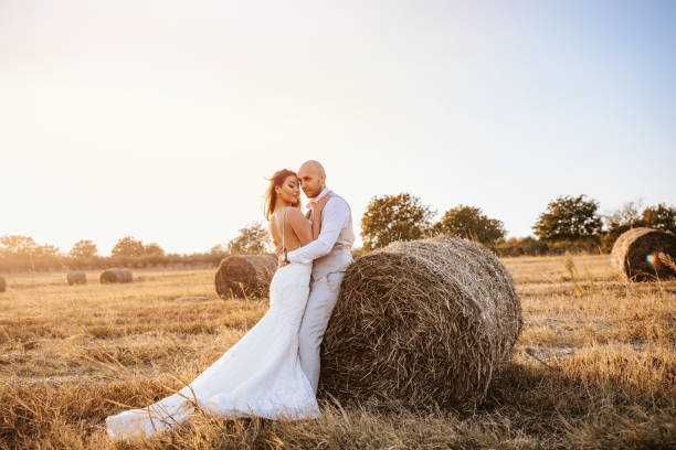 istock Wedding couple in a hay field 1124538575
