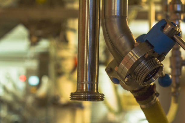 istock Pipes and valves macro photograph in microbrewery 1124539465