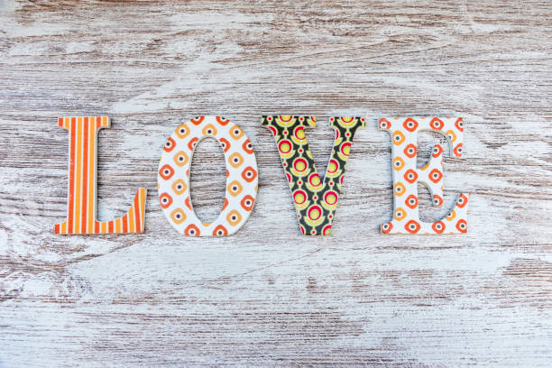 istock Vintage wooden love letters on rustic background with copy space. Romanticism concept. 1124539469