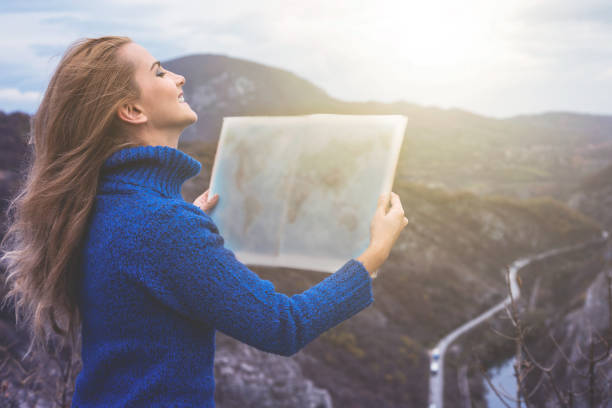 istock Happy travel woman look map 1124547687