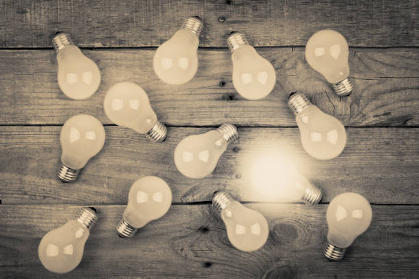 istock Vintage bulbs on wooden background - idea, innovation, teamwork and leadership concept. Space for text 1124547704