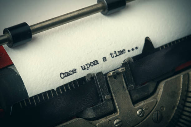 Close up of old typewriter covered with dust with Once upon a time text stock photo