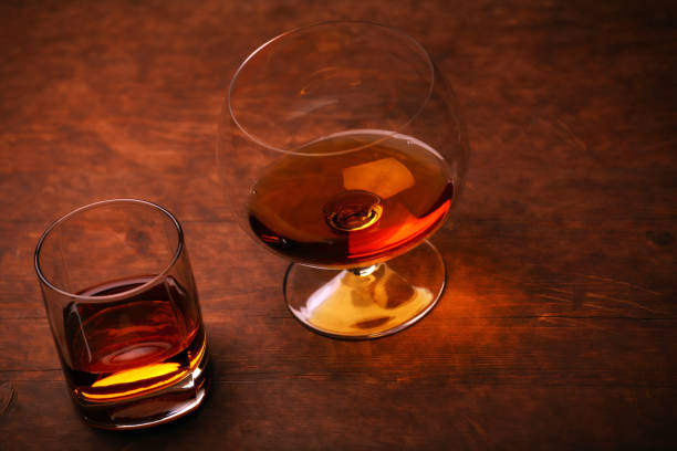 istock whiskey glass wooden background 1124550139