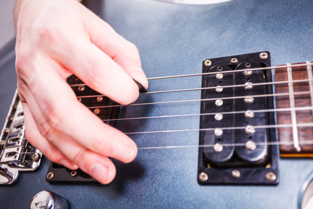 istock Close up of man playing on electric guitar 1124551787