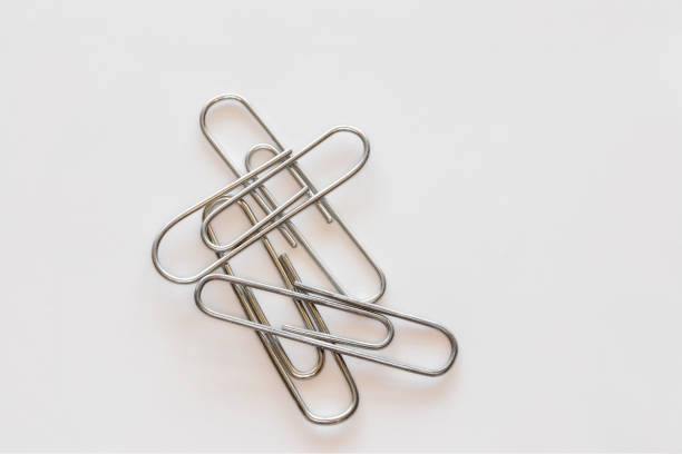 istock Paper clips, single and in different arrangements. 1124554000