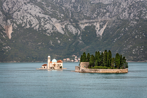 The small islands Sv Djorde (St Georg) and Gospa od Škrpjela with a church on it in the 30km long Kotor Bay in Montenegro. It's part of the UNESCO World Heritage.