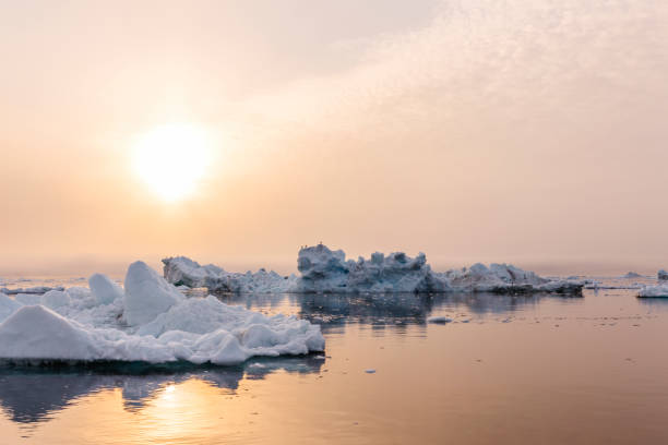 istock Iceberg on beautiful sea in the sunset 1124563085