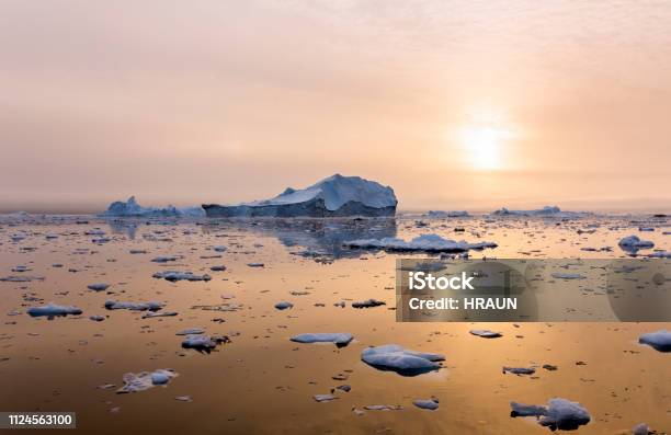 Iceberg Near Greenland In The Sunset Stock Photo - Download Image Now - Antarctic Ocean, Ice, Arctic