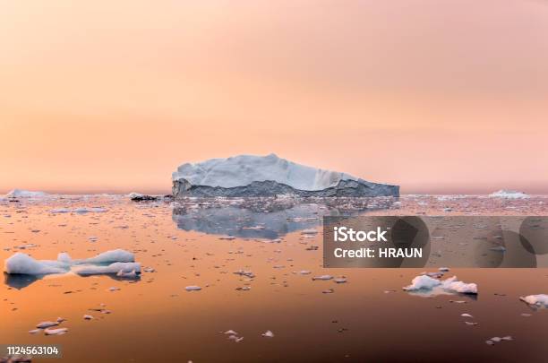 Iceberg On Beautiful Sea In The Sunset Stock Photo - Download Image Now - Iceberg - Ice Formation, Arctic, Greenland