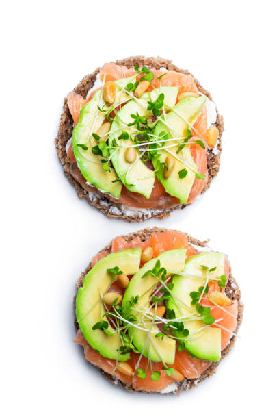 istock Salmon and avocado rye bread sandwich isolated on white 1124564858