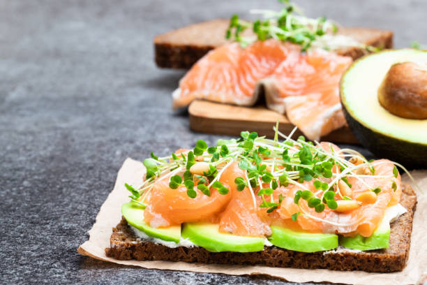 istock Salmon and avocado rye bread sandwich on gray table 1124565066