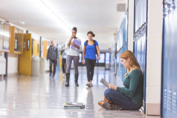 istock Female student studying in the school hallway 1124565859