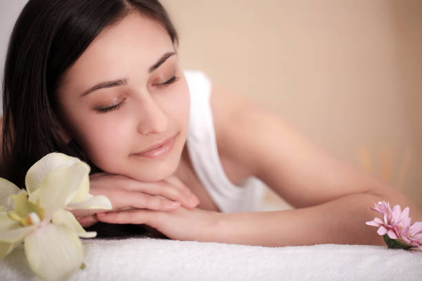 istock Spa Massage. Beautiful Brunette Gets Spa Treatment in Salon. 1124570376