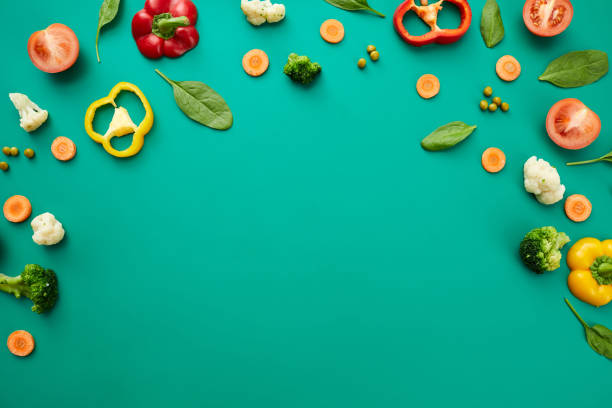 Fresh vegetables on green background