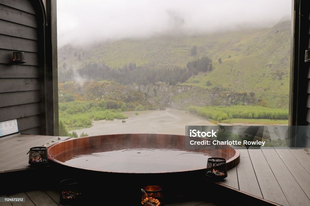 Queenstown hot tub Queenstown hot tub looking over shotover river Hot Tub Stock Photo