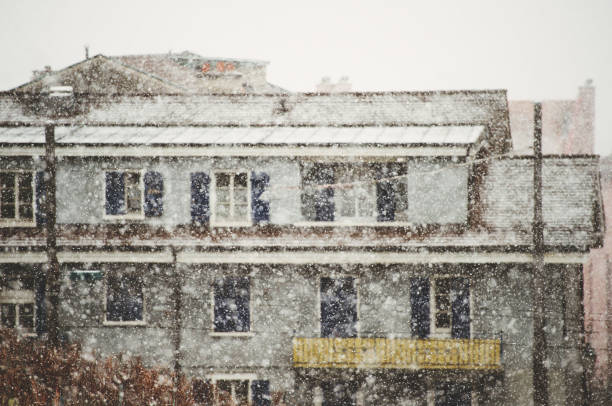 Heavy snow falls in a city, blurred image