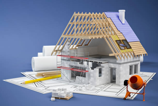 istock House construction, plans and cement mixer, blue background 1124574503
