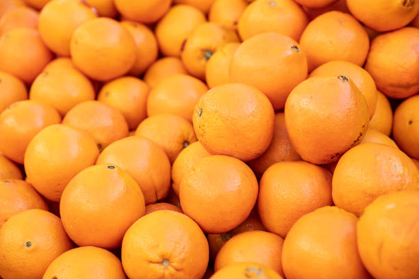 istock Closeup of sliced oranges on a market 1124576602
