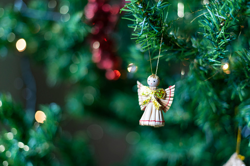 View of an angel ornament on a Christmas tree