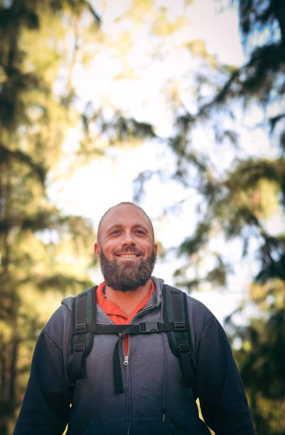istock Man hiking in the woods, wilderness 1124589534