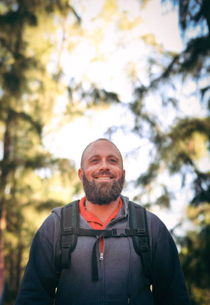 istock Man hiking in the woods, wilderness 1124589578