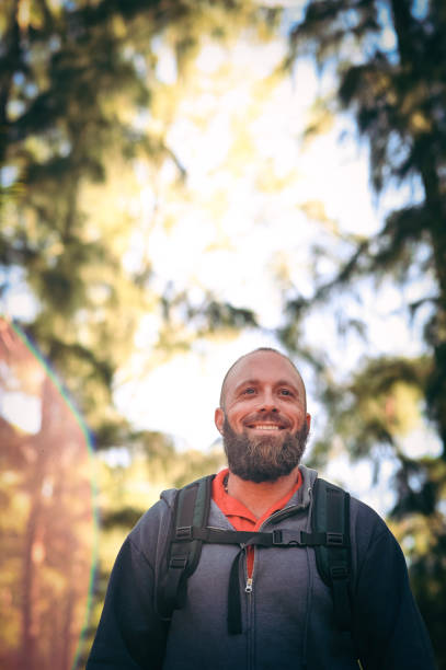 istock Man hiking in the woods, wilderness 1124589597