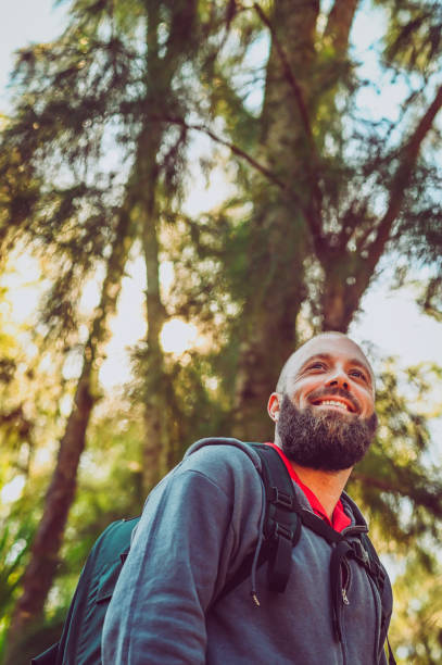 istock Man hiking in the woods, wilderness 1124590217
