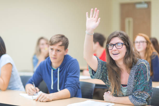 istock College students asking questions in the classroom 1124592563