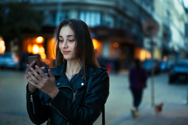 istock Young girl using her smartphone 1124593273