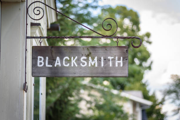 istock Wooden blacksmith sign on building exterior 1124596448