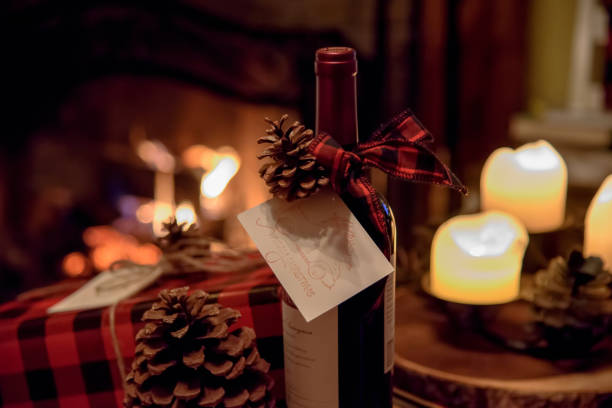wine bottle gifts and cozy fireplace - date night imagens e fotografias de stock