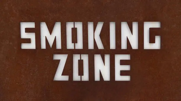 Close-up of designated smoking area sign. Sign of smoking zone. For peace of mind to separate the smokers from the non-smoking zone.