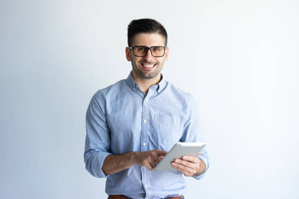 istock Cheerful professional in glasses studying report 1124605446